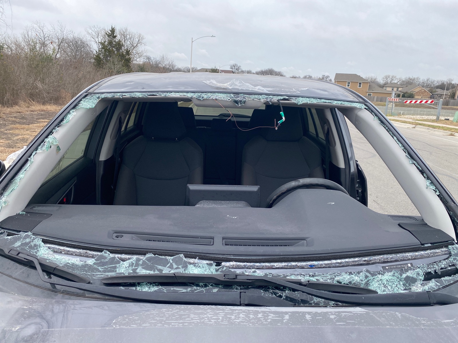 Windshield before and after replacement — before