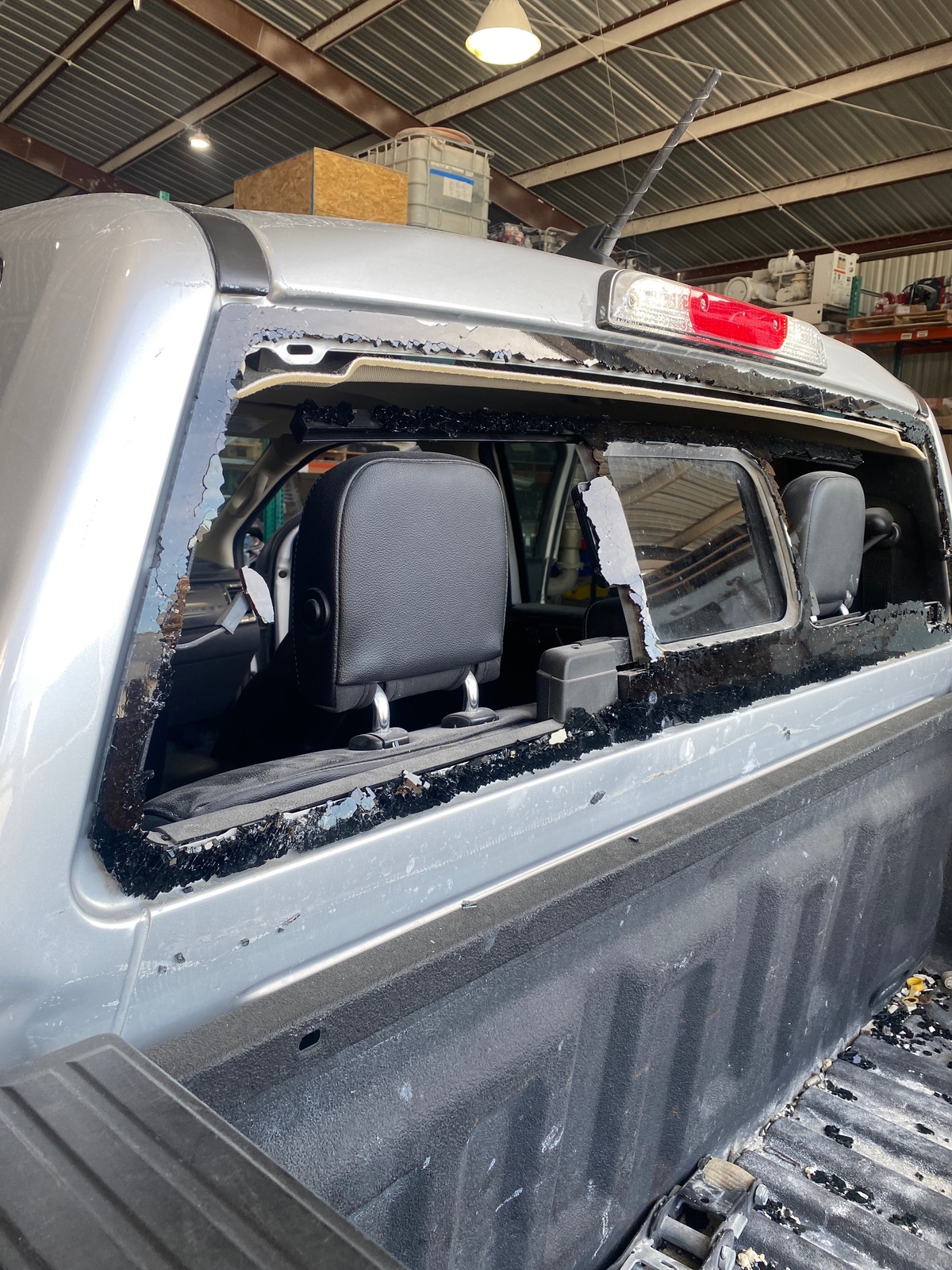 Truck back glass before and after replacement — before